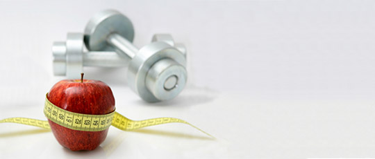 Red apple and tape measure